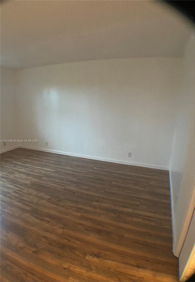 2061 NW 47th Ter Unit 205, Lauderhill, FL 33313 - empty room with dark wood-type flooring and baseboards
