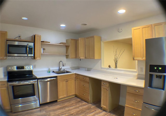 2061 NW 47th Ter Unit 205, Lauderhill, FL 33313 - kitchen featuring appliances with stainless steel finishes, a sink, light countertops, wood finished floors, and recessed lighting