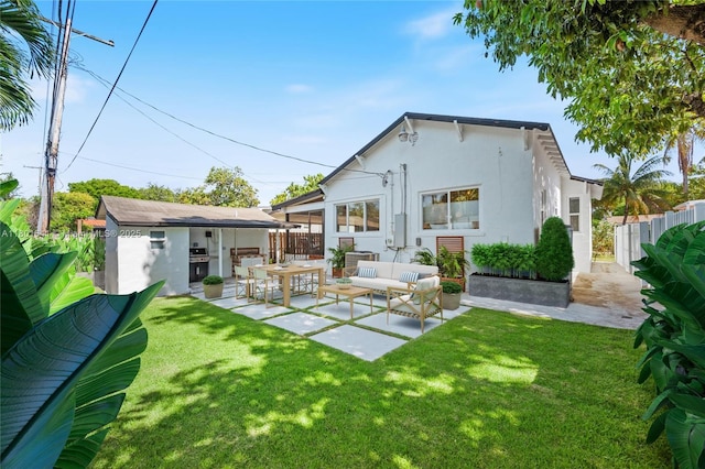 1780 SW 14th Ter, Miami, FL 33145 - back of house with stucco siding, a patio, outdoor lounge area, and an outdoor structure