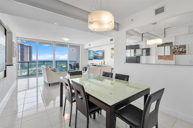 19400 Turnberry Way Unit 1131, Aventura, FL 33180 - dining room with light tile patterned floors and baseboards