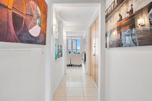 19400 Turnberry Way Unit 1131, Aventura, FL 33180 - hall with tile patterned flooring and baseboards