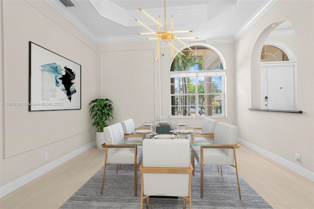 2539 Eagle Run Dr, Weston, FL 33327 - dining room with crown molding, a raised ceiling, a chandelier, and baseboards