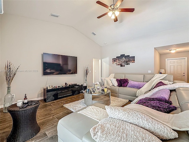 6142 NW Hopkins Ave, Port St Lucie, FL 34986 - living room featuring wood tiled floors, ceiling fan, vaulted ceiling, and baseboards