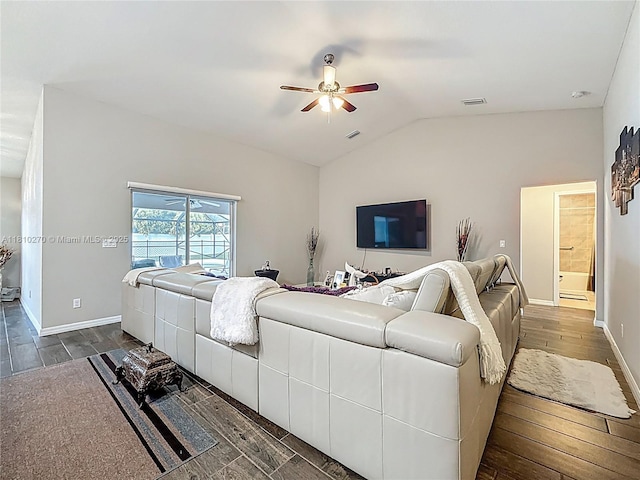 6142 NW Hopkins Ave, Port St Lucie, FL 34986 - living area with wood finished floors, a ceiling fan, lofted ceiling, and baseboards