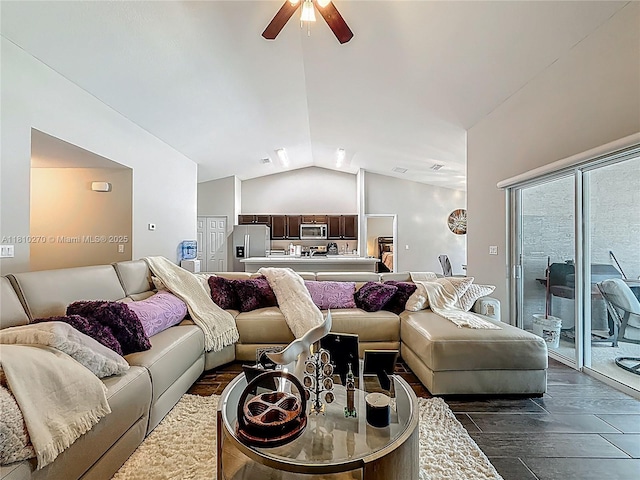 6142 NW Hopkins Ave, Port St Lucie, FL 34986 - living area featuring vaulted ceiling, ceiling fan, and dark wood finished floors