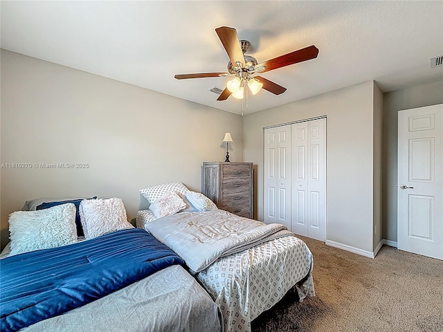 6142 NW Hopkins Ave, Port St Lucie, FL 34986 - carpeted bedroom with a closet, baseboards, and a ceiling fan