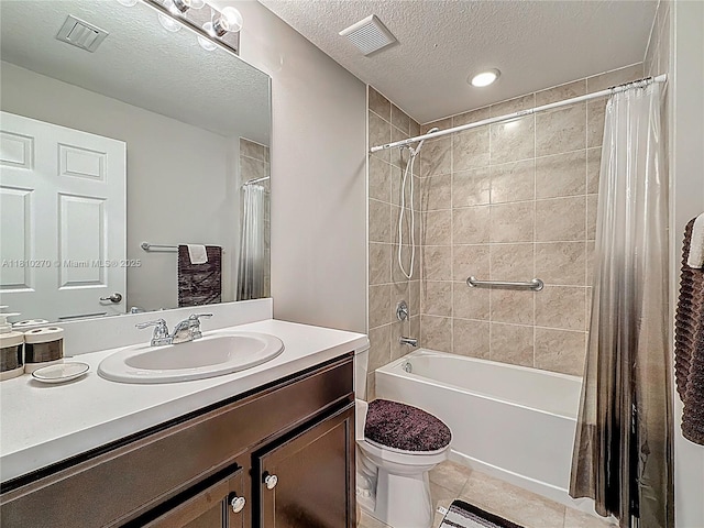 6142 NW Hopkins Ave, Port St Lucie, FL 34986 - bathroom with vanity, shower / tub combo, toilet, tile patterned floors, and a textured ceiling