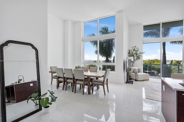 1900 N Bayshore Dr Unit 603, Miami, FL 33132 - dining space with light tile patterned floors and floor to ceiling windows