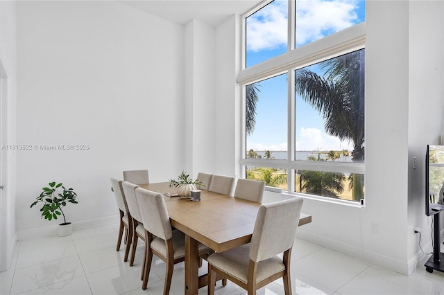 1900 N Bayshore Dr Unit 603, Miami, FL 33132 - dining space featuring baseboards