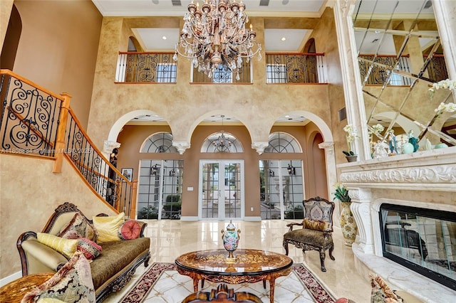 3308 Islewood Ave, Weston, FL 33332 - living room with arched walkways, a towering ceiling, a chandelier, stairs, and a fireplace