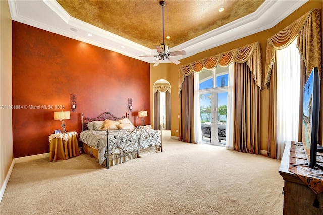 3308 Islewood Ave, Weston, FL 33332 - carpeted bedroom featuring a raised ceiling, access to outside, ornamental molding, arched walkways, and baseboards