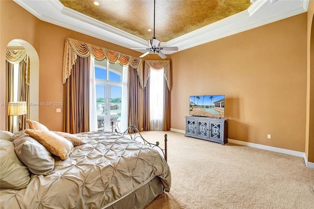 3308 Islewood Ave, Weston, FL 33332 - bedroom featuring a tray ceiling, ornamental molding, arched walkways, access to outside, and french doors