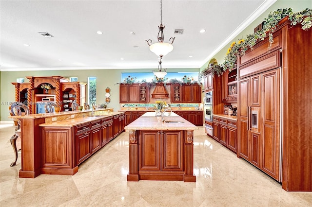 3308 Islewood Ave, Weston, FL 33332 - kitchen featuring crown molding, decorative light fixtures, light stone counters, a sink, and a kitchen bar