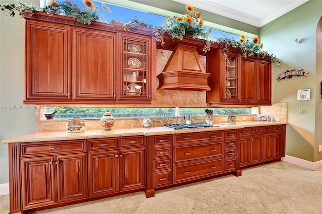 3308 Islewood Ave, Weston, FL 33332 - kitchen featuring backsplash, crown molding, glass insert cabinets, custom exhaust hood, and baseboards