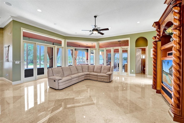 3308 Islewood Ave, Weston, FL 33332 - living area featuring french doors, ornamental molding, ceiling fan, baseboards, and arched walkways