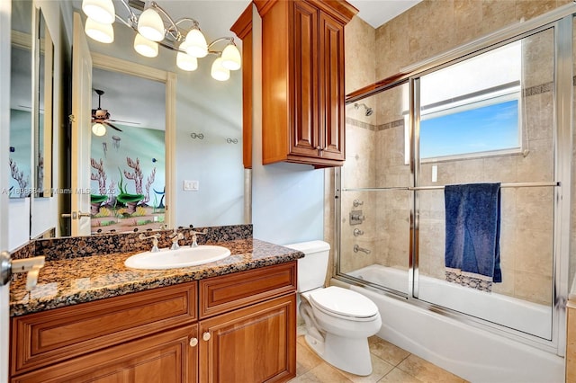 3308 Islewood Ave, Weston, FL 33332 - bathroom featuring vanity, combined bath / shower with glass door, toilet, a ceiling fan, and tile patterned flooring