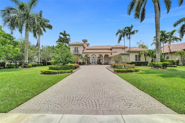 3308 Islewood Ave, Weston, FL 33332 - mediterranean / spanish-style home featuring curved driveway, stucco siding, and a front yard