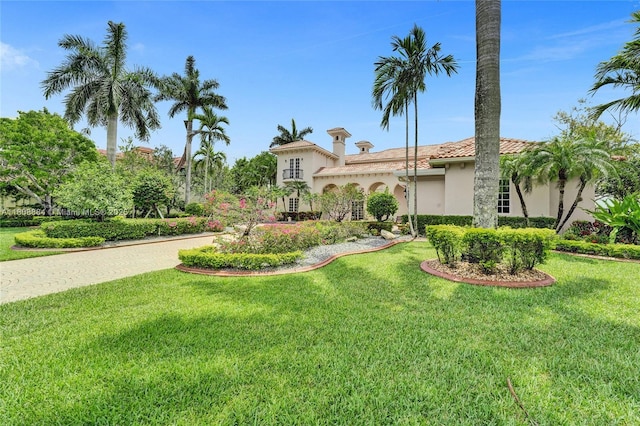 3308 Islewood Ave, Weston, FL 33332 - mediterranean / spanish-style house with stucco siding, a front yard, and a tile roof