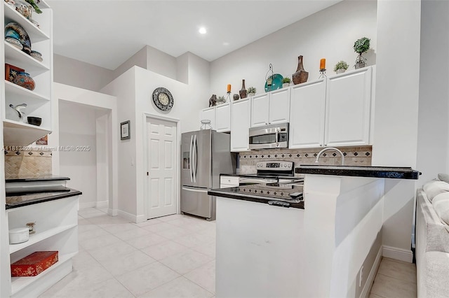 3943 Nighthawk Dr, Weston, FL 33331 - kitchen featuring stainless steel appliances, open shelves, dark countertops, tasteful backsplash, and white cabinetry