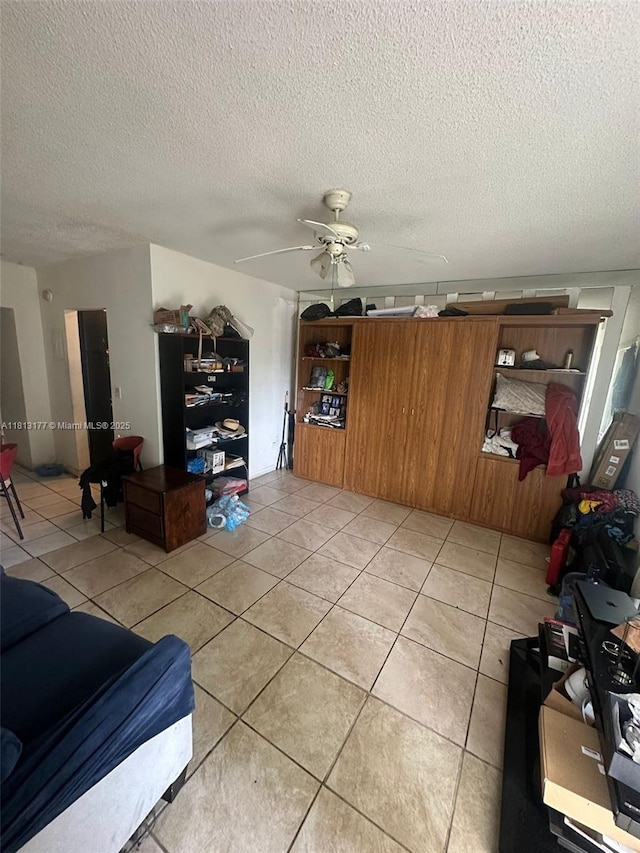 100 NW 204th St Unit 3, Miami Gardens, FL 33169 - living area featuring a textured ceiling, a ceiling fan, and light tile patterned flooring