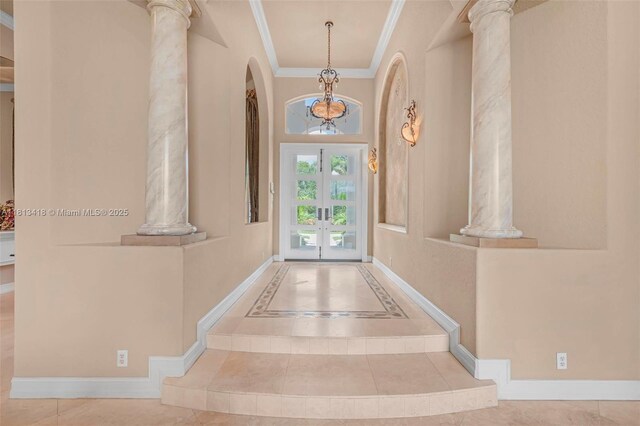 3250 W Stonebrook Cir, Davie, FL 33330 - tiled entrance foyer with decorative columns, arched walkways, ornamental molding, french doors, and baseboards