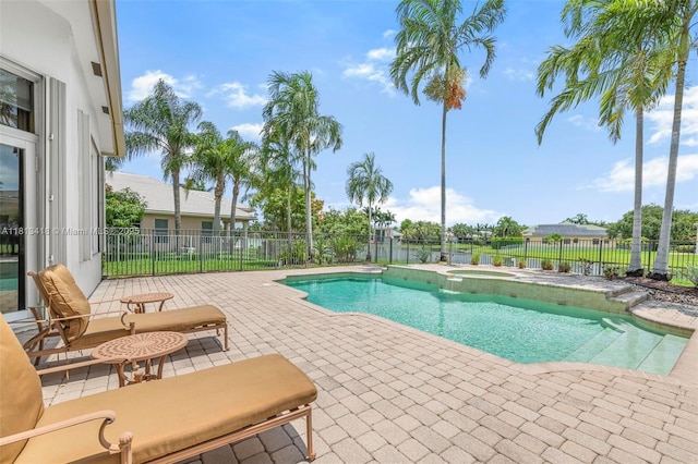 3250 W Stonebrook Cir, Davie, FL 33330 - view of pool featuring a patio, a fenced backyard, and a pool with connected hot tub