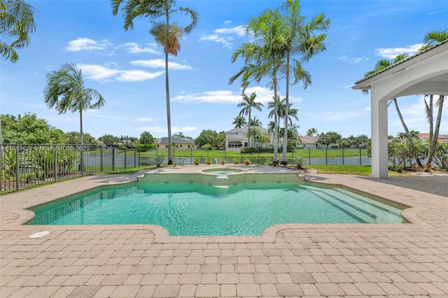 3250 W Stonebrook Cir, Davie, FL 33330 - view of swimming pool featuring an in-ground hot tub, a fenced backyard, and a patio