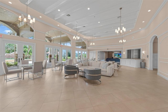 3250 W Stonebrook Cir, Davie, FL 33330 - living room featuring a chandelier, a high ceiling, light tile patterned floors, french doors, and recessed lighting