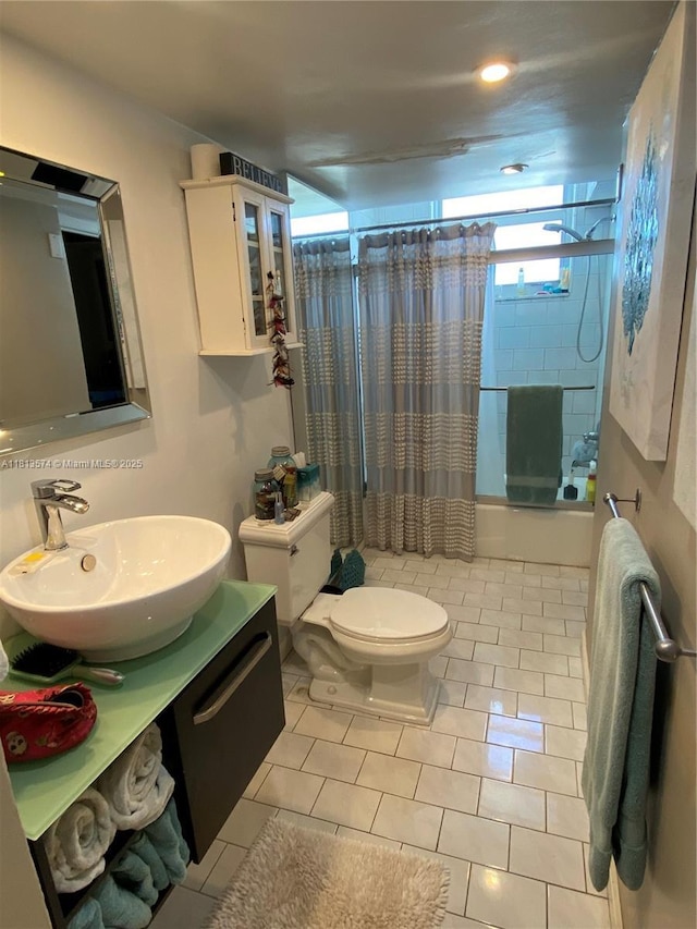 6900 Bay Dr Unit 10D, Miami Beach, FL 33141 - full bath featuring toilet, shower / bathtub combination with curtain, tile patterned floors, and vanity