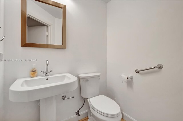 3330 NE 190th St Unit 416, Aventura, FL 33180 - half bathroom with toilet and baseboards