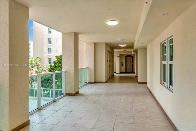 3330 NE 190th St Unit 416, Aventura, FL 33180 - hallway with a textured wall and light tile patterned floors