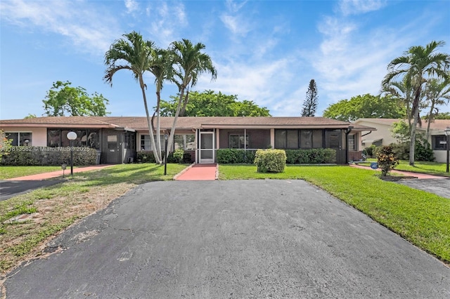 14386 Campanelli Dr, Delray Beach, FL 33484 - single story home featuring a sunroom and a front yard