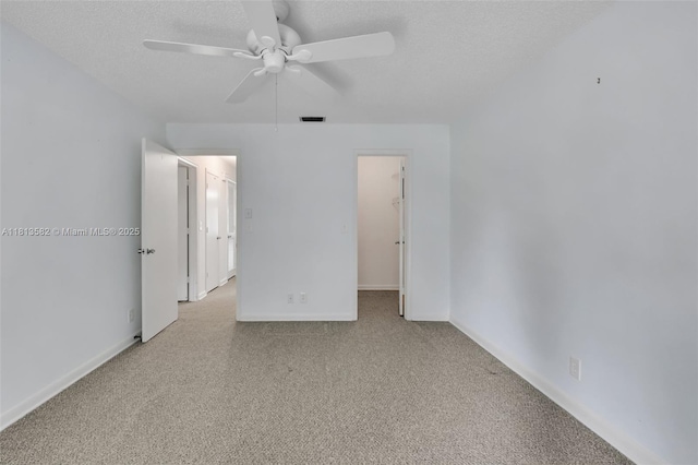 14386 Campanelli Dr, Delray Beach, FL 33484 - empty room featuring light carpet, ceiling fan, a textured ceiling, and baseboards