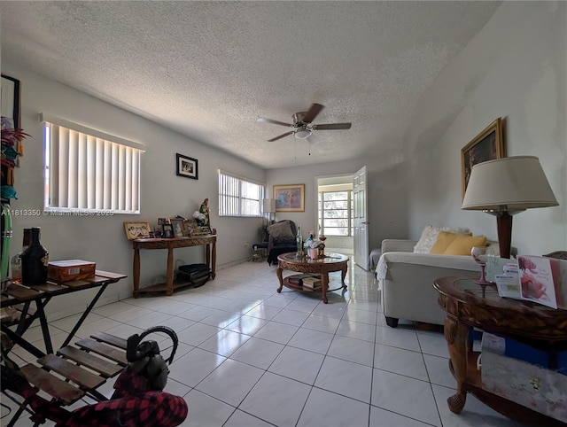 19080 NE 3rd Ct Unit 311, Miami, FL 33179 - living area featuring a ceiling fan, a textured ceiling, and light tile patterned flooring