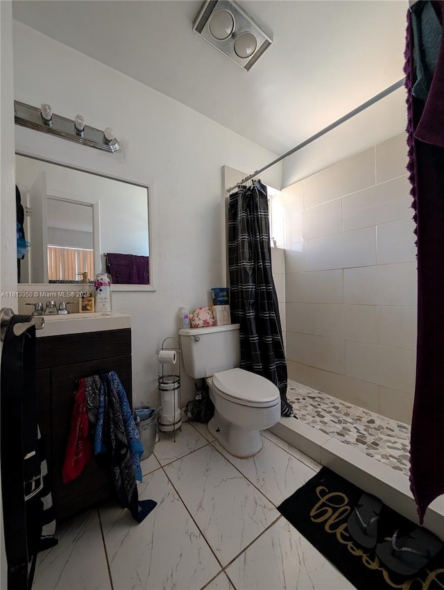 19080 NE 3rd Ct Unit 311, Miami, FL 33179 - bathroom featuring toilet, marble finish flooring, tiled shower, and vanity