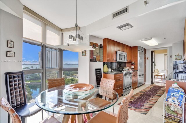 1000 Quayside Ter Unit 1101, Miami, FL 33138 - dining area with a chandelier and light tile patterned flooring