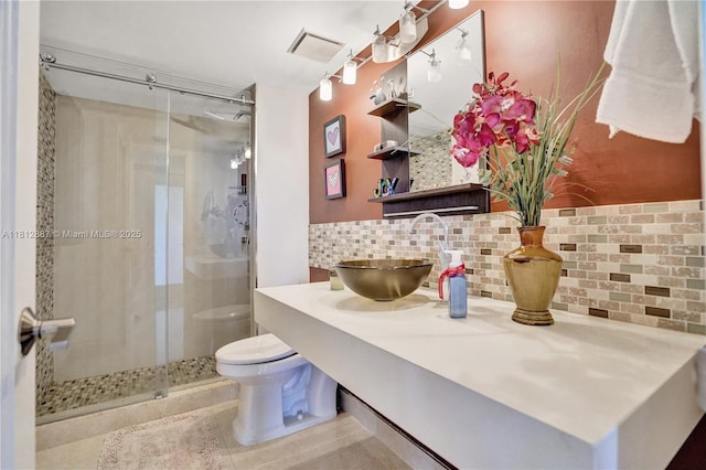 1000 Quayside Ter Unit 1101, Miami, FL 33138 - bathroom with toilet, backsplash, a shower stall, vanity, and tile patterned flooring