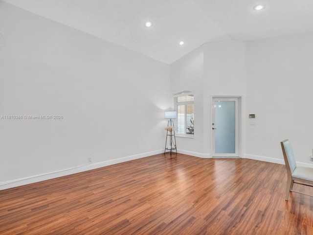 2810 River Run Cir E, Miramar, FL 33025 - unfurnished living room with wood finished floors, baseboards, high vaulted ceiling, and recessed lighting