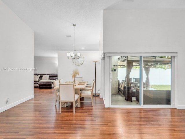 2810 River Run Cir E, Miramar, FL 33025 - dining space featuring wood finished floors, a chandelier, and baseboards
