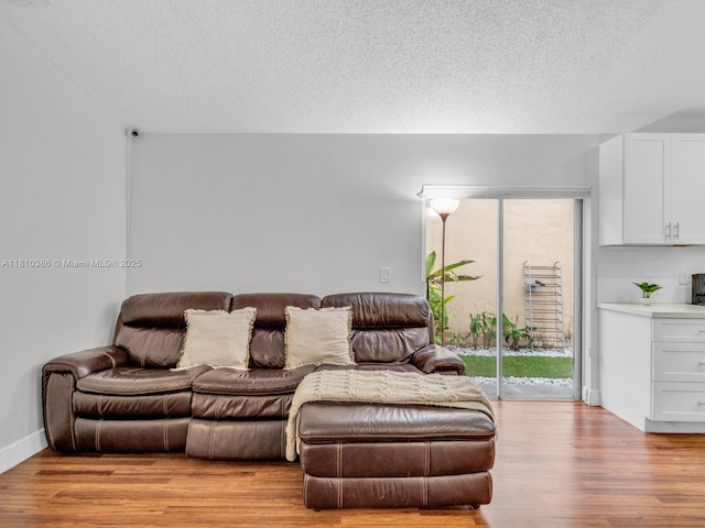 2810 River Run Cir E, Miramar, FL 33025 - living area featuring wood finished floors and a textured ceiling