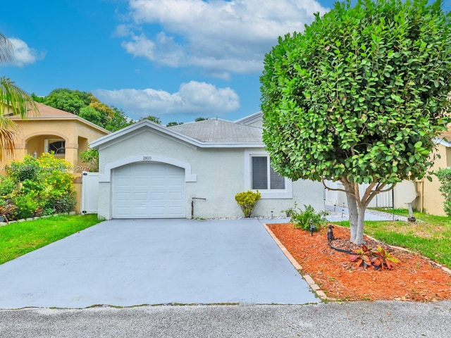 2810 River Run Cir E, Miramar, FL 33025 - view of front of home featuring stucco siding, an attached garage, and driveway