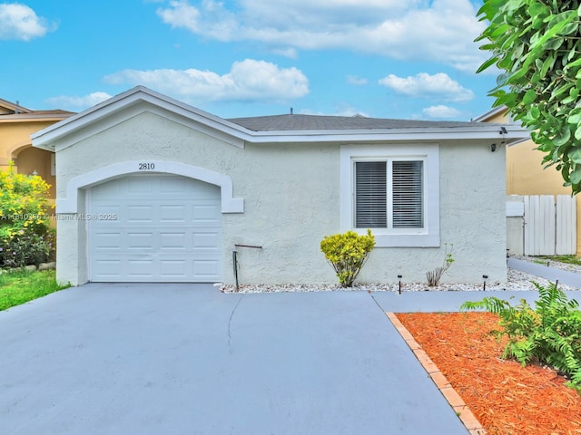 2810 River Run Cir E, Miramar, FL 33025 - view of front of home featuring stucco siding, driveway, and a garage