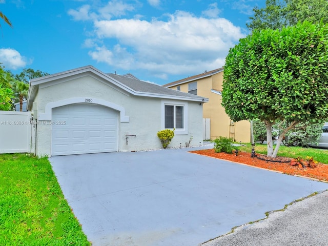 2810 River Run Cir E, Miramar, FL 33025 - view of front of home featuring stucco siding, a garage, and concrete driveway