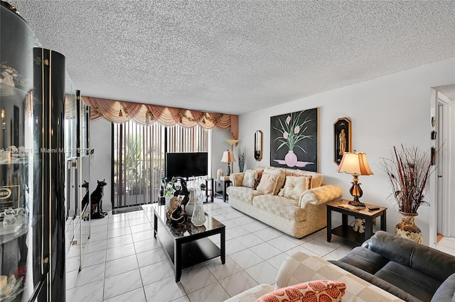 6195 Rock Island Rd Unit 215, Tamarac, FL 33319 - living room featuring a textured ceiling and light tile patterned floors