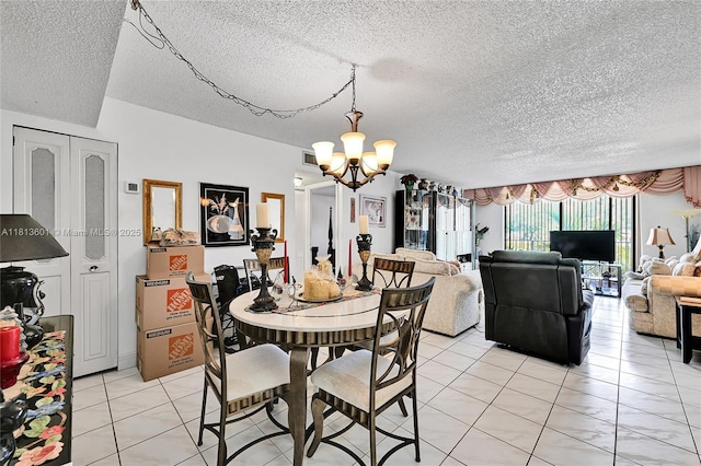 6195 Rock Island Rd Unit 215, Tamarac, FL 33319 - dining space with a chandelier, a textured ceiling, and light tile patterned floors
