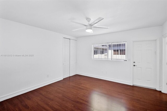 7342 Gary Ave, Miami Beach, FL 33141 - unfurnished room featuring dark wood-type flooring, baseboards, and a ceiling fan