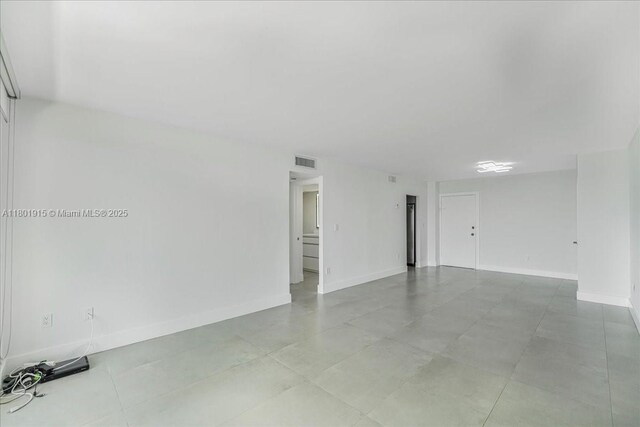 1865 79th St Unit 12G, North Bay Village, FL 33141 - spare room featuring baseboards