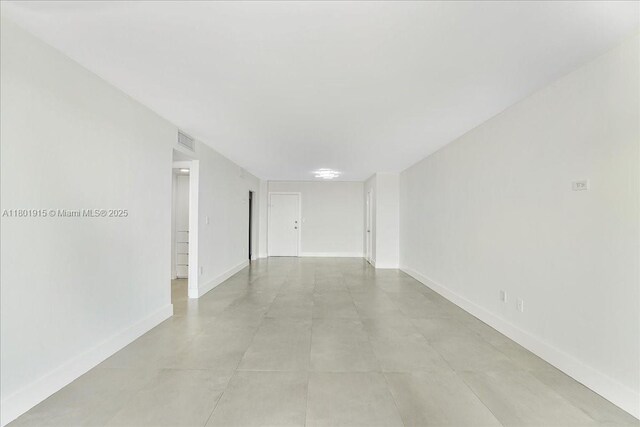 1865 79th St Unit 12G, North Bay Village, FL 33141 - unfurnished room with baseboards and concrete flooring
