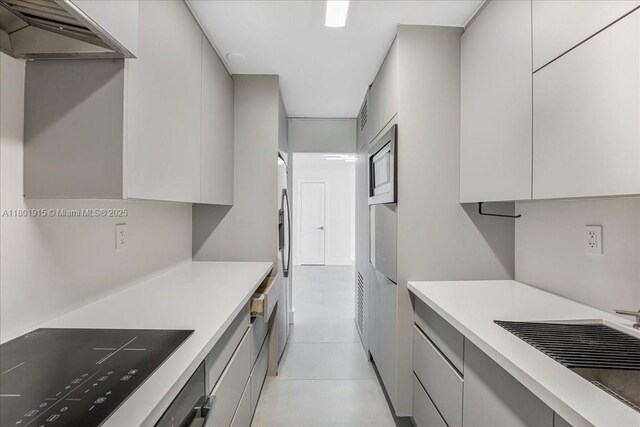 1865 79th St Unit 12G, North Bay Village, FL 33141 - kitchen featuring modern cabinets, light countertops, stainless steel appliances, and gray cabinetry
