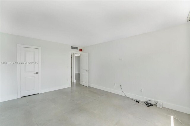 1865 79th St Unit 12G, North Bay Village, FL 33141 - unfurnished bedroom with baseboards